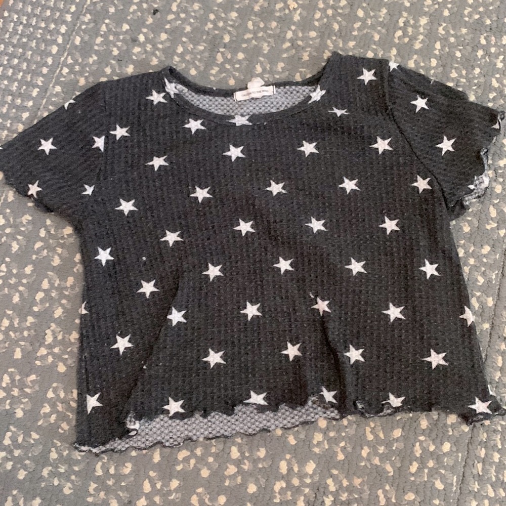 A cute ruffle top! has cute stars on it and very comfy!!